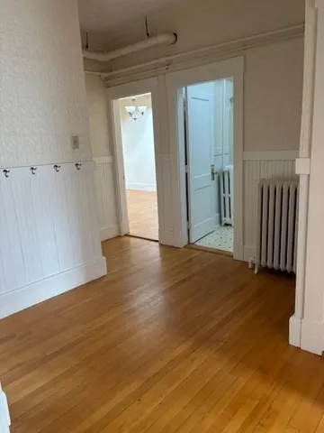 a view of entryway with wooden floor