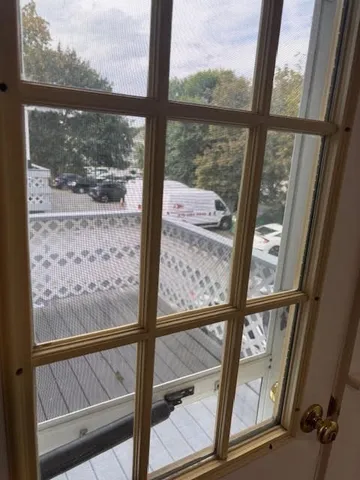 a view of a glass door with a from a window