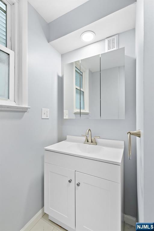 736 2nd Street, Unit 1 Secaucus, NJ 07094 - Photo 11 of 21 a bathroom with a sink and a mirror