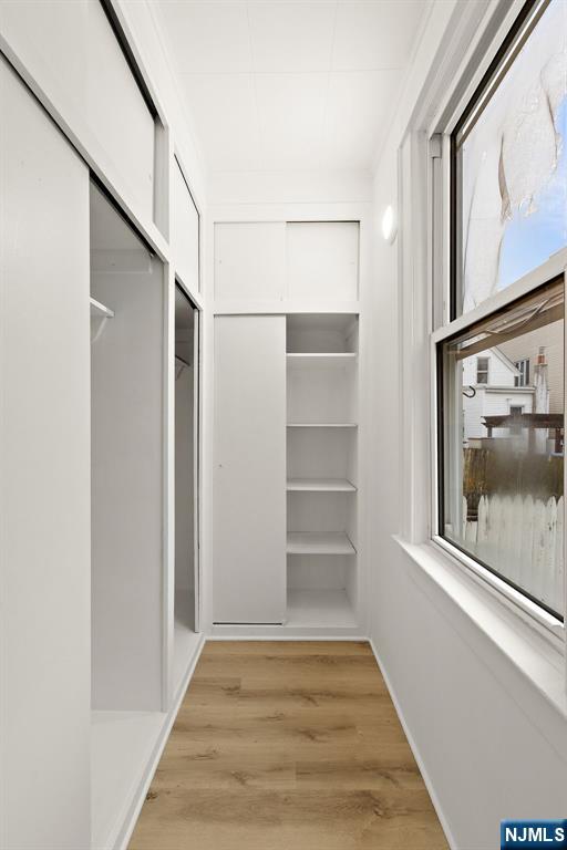 736 2nd Street, Unit 1 Secaucus, NJ 07094 - Photo 15 of 21 a view of empty room with wooden floor and fan