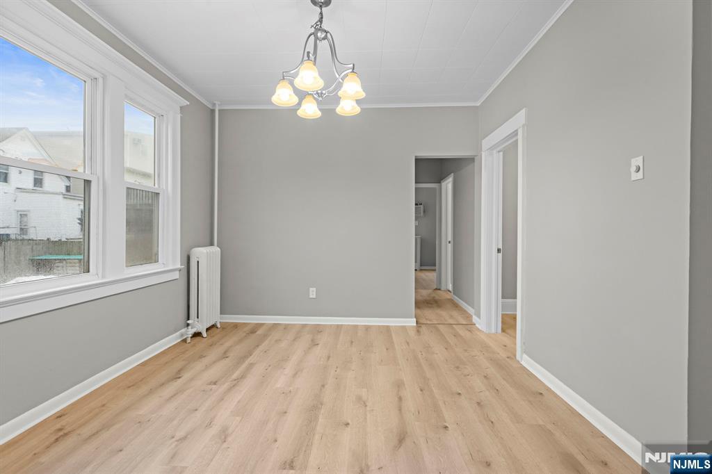736 2nd Street, Unit 1 Secaucus, NJ 07094 - Photo 4 of 21 wooden floor in an empty room with a window