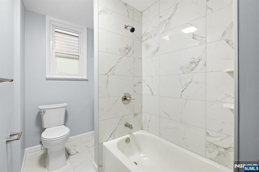 736 2nd Street, Unit 1 Secaucus, NJ 07094 - Photo 10 of 21 a bathroom with a toilet and a bathtub