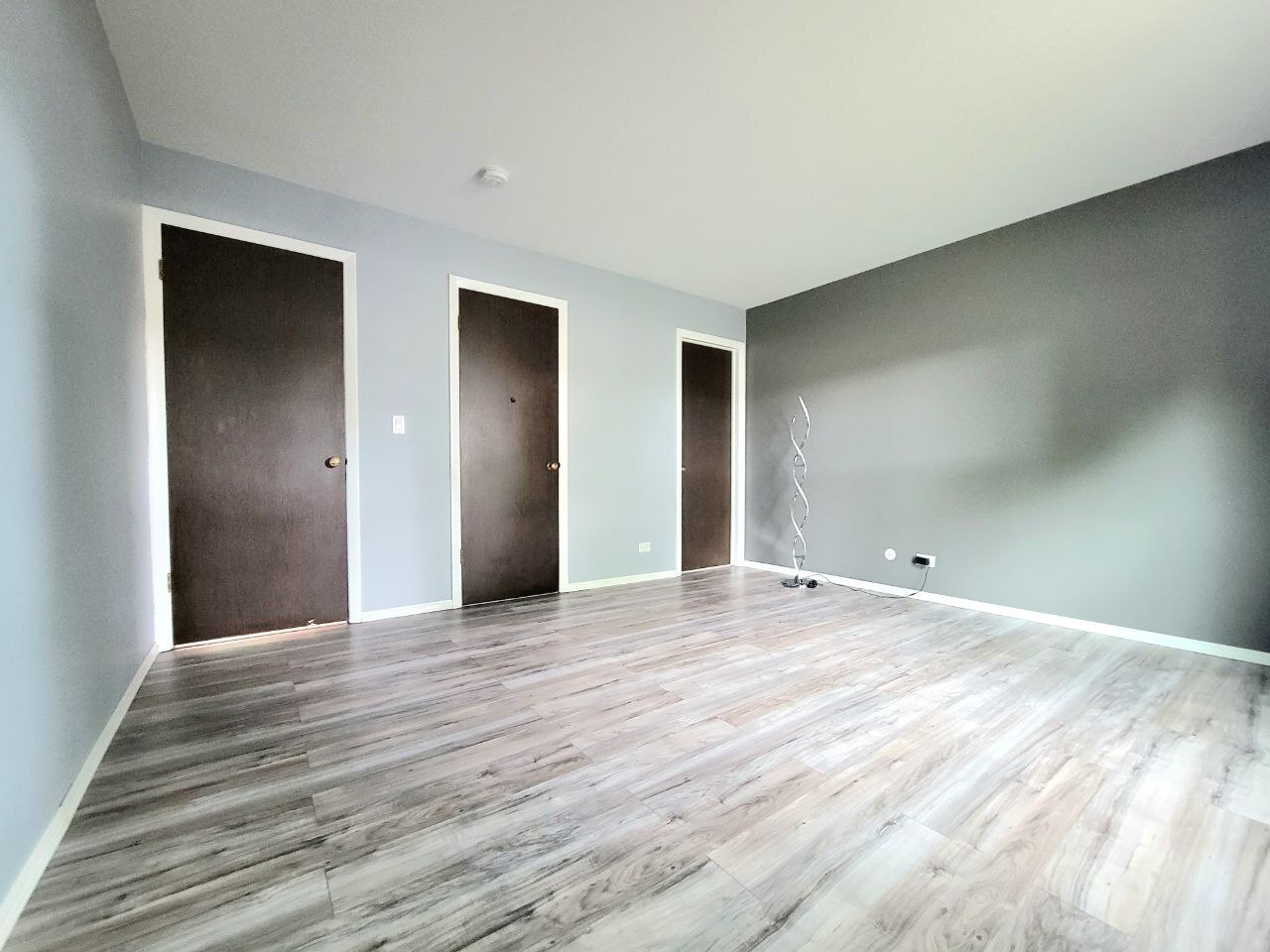 4730 Calvert Drive, Unit B1 Rolling Meadows, IL 60008 - Photo 14 of 23 a view of an empty room with wooden floor