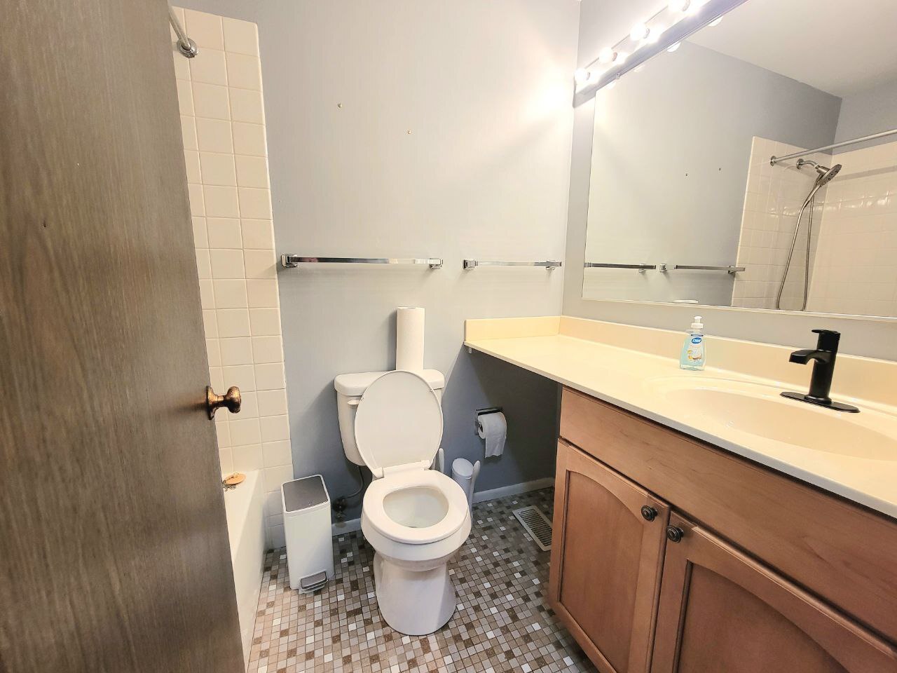 4730 Calvert Drive, Unit B1 Rolling Meadows, IL 60008 - Photo 20 of 23 a bathroom with a sink toilet and shower