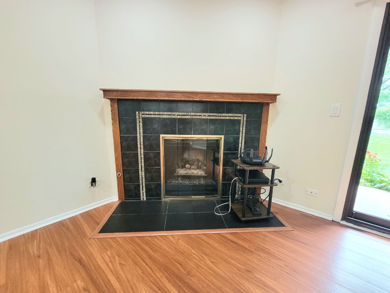 4730 Calvert Drive, Unit B1 Rolling Meadows, IL 60008 - Photo 9 of 23 a view of a livingroom with wooden floor and a fireplace
