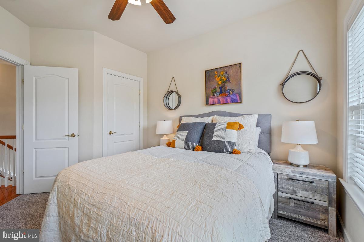 4091 River Forth Drive Fairfax, VA 22030 - Photo 16 of 32 a bedroom with bed and wooden floor