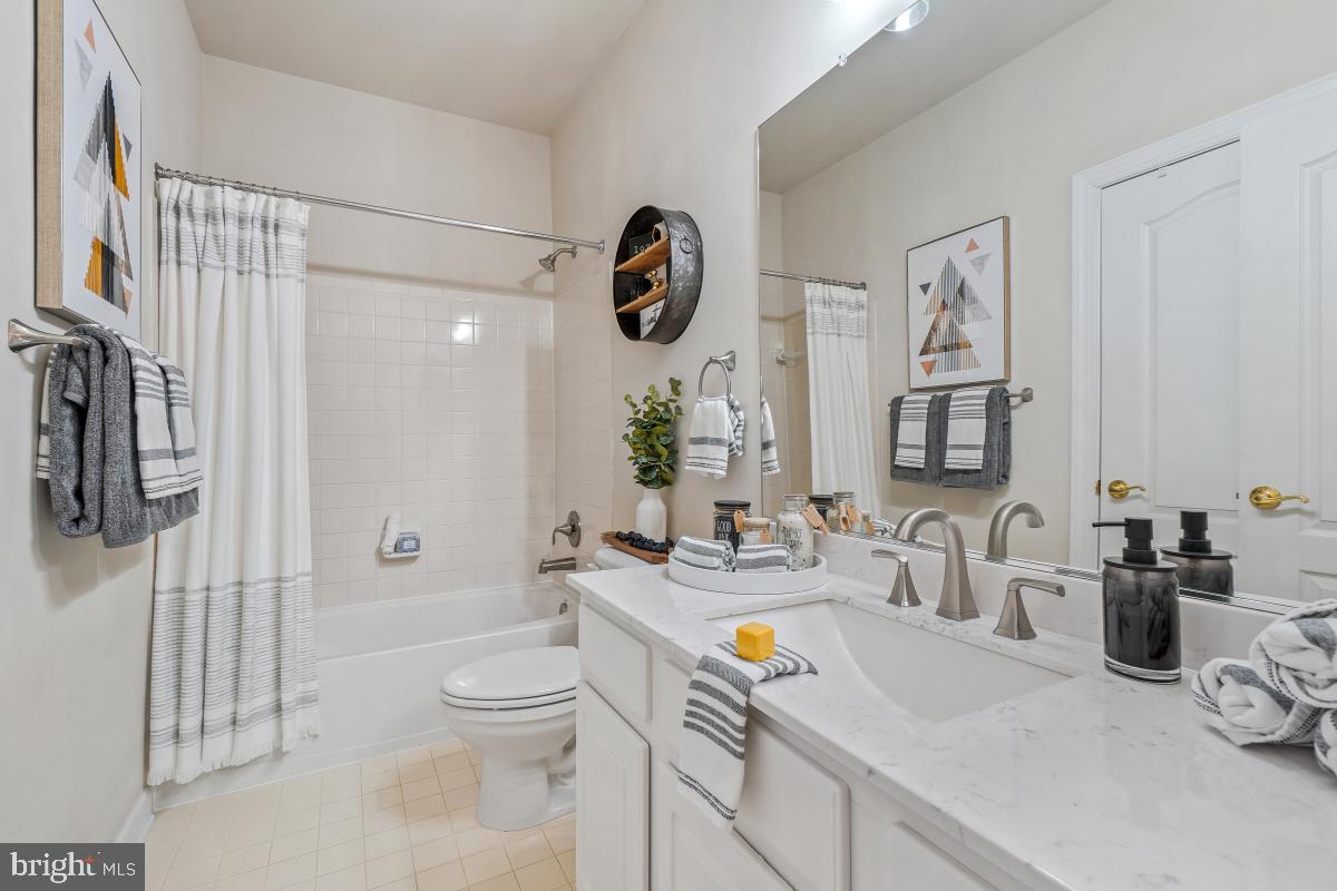 4091 River Forth Drive Fairfax, VA 22030 - Photo 19 of 32 a bathroom with a sink a toilet and shower