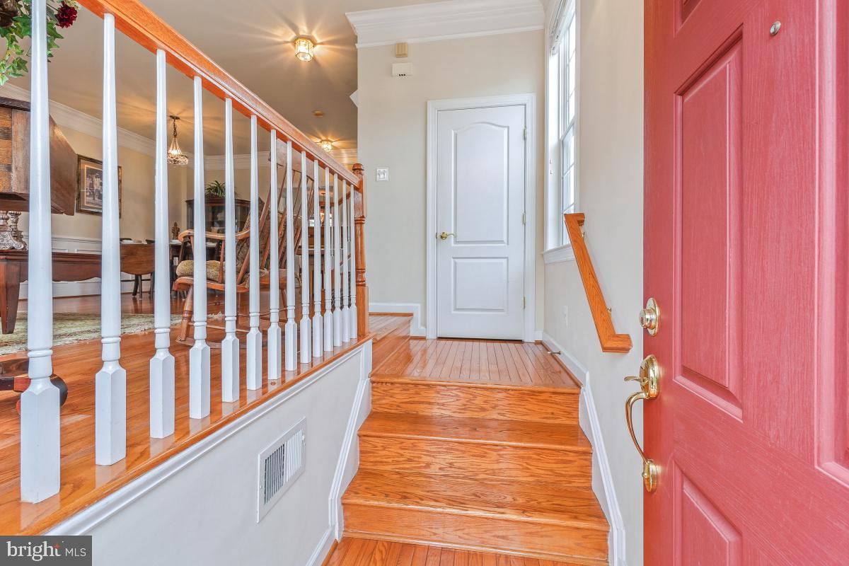 4091 River Forth Drive Fairfax, VA 22030 - Photo 2 of 32 a view of staircase with railing and a rug