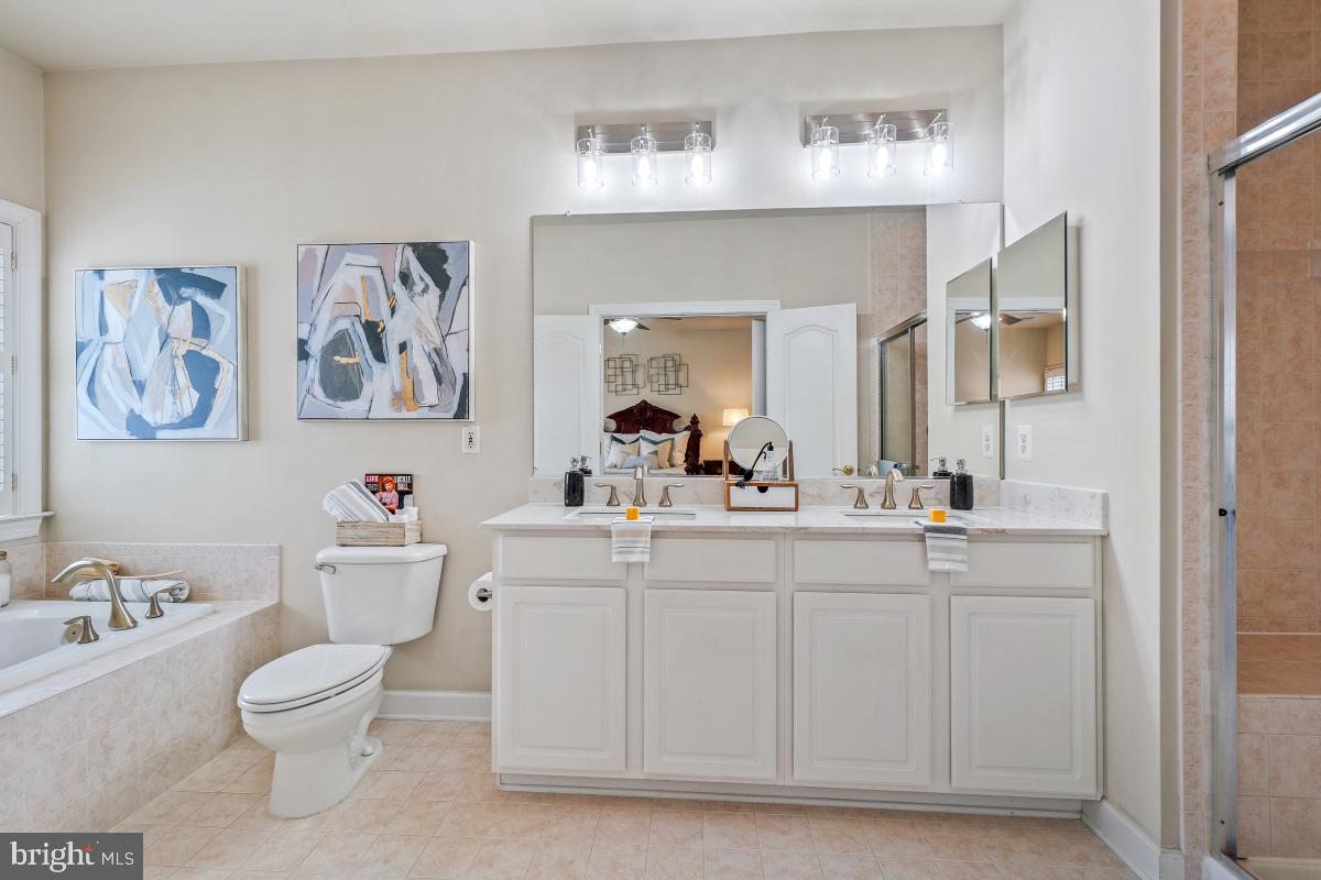 4091 River Forth Drive Fairfax, VA 22030 - Photo 26 of 32 a bathroom with a toilet sink and mirror