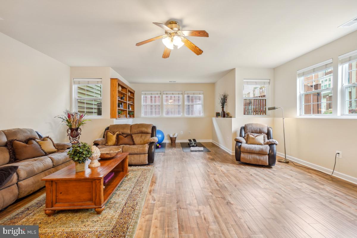 4091 River Forth Drive Fairfax, VA 22030 - Photo 27 of 32 a living room with furniture and wooden floor