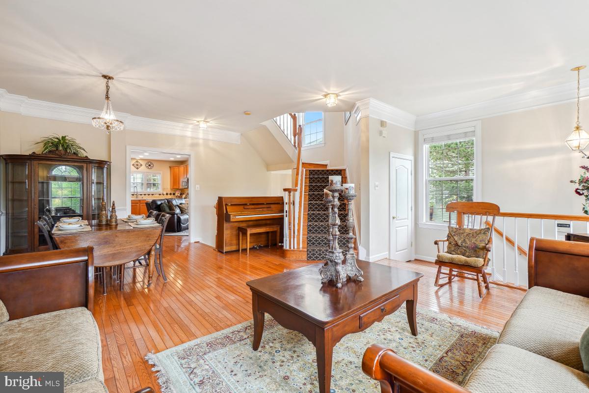 4091 River Forth Drive Fairfax, VA 22030 - Photo 4 of 32 a living room with fireplace furniture and a wooden floor