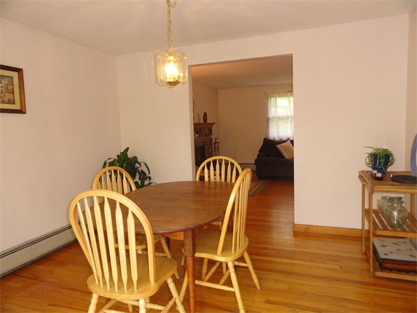 115 Leverett Road Amherst, MA 01002 - Photo 12 of 15 a view of a dining room with furniture and wooden floor