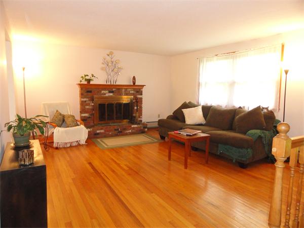 115 Leverett Road Amherst, MA 01002 - Photo 2 of 15 a living room with furniture and a fireplace
