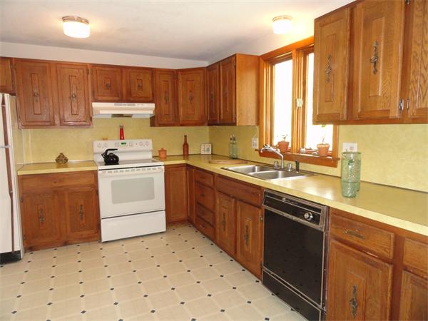 115 Leverett Road Amherst, MA 01002 - Photo 6 of 15 a kitchen with a sink stove and cabinets
