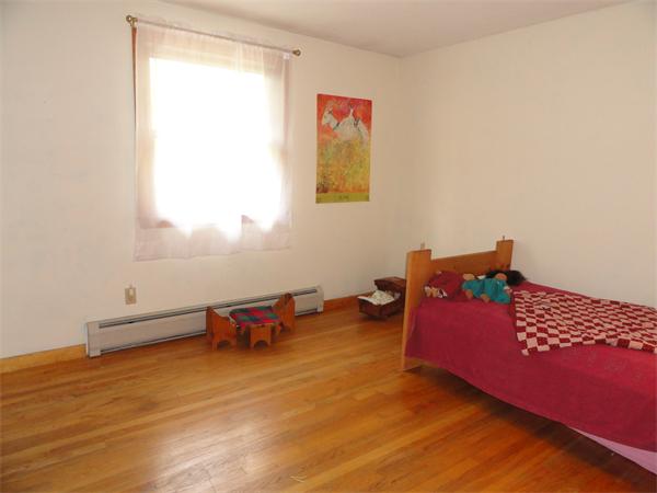 115 Leverett Road Amherst, MA 01002 - Photo 9 of 15 a bedroom with furniture and a window