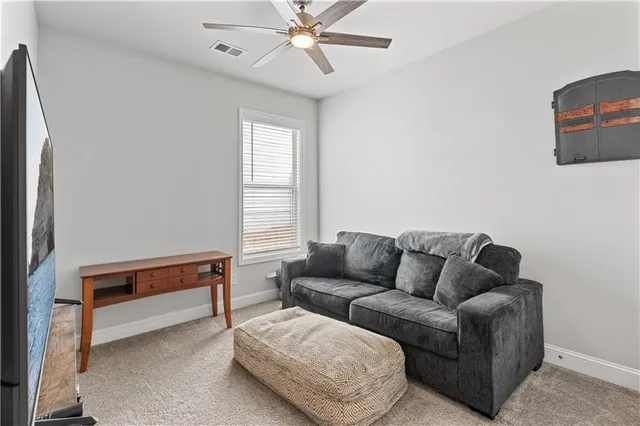 a white toilet sitting next to a shower