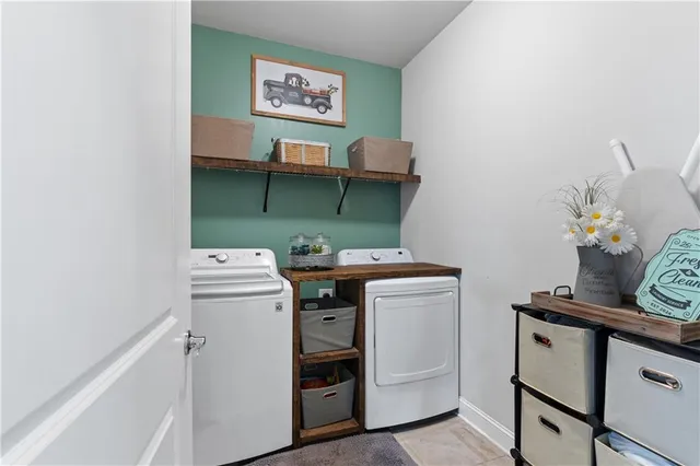 a view of walk in closet with clothes