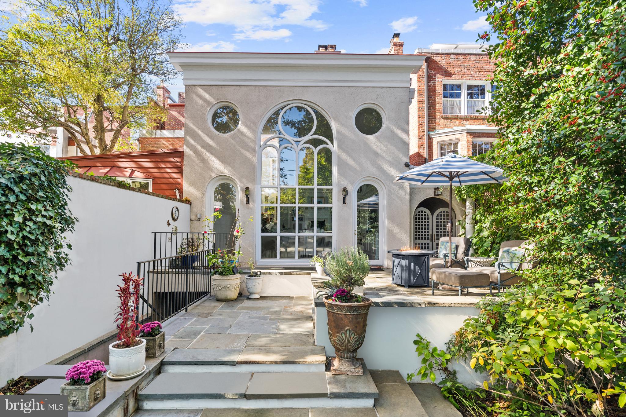 1409 31st Street Northwest Washington, DC 20007 - Photo 3 of 8 a view of a building with potted plants