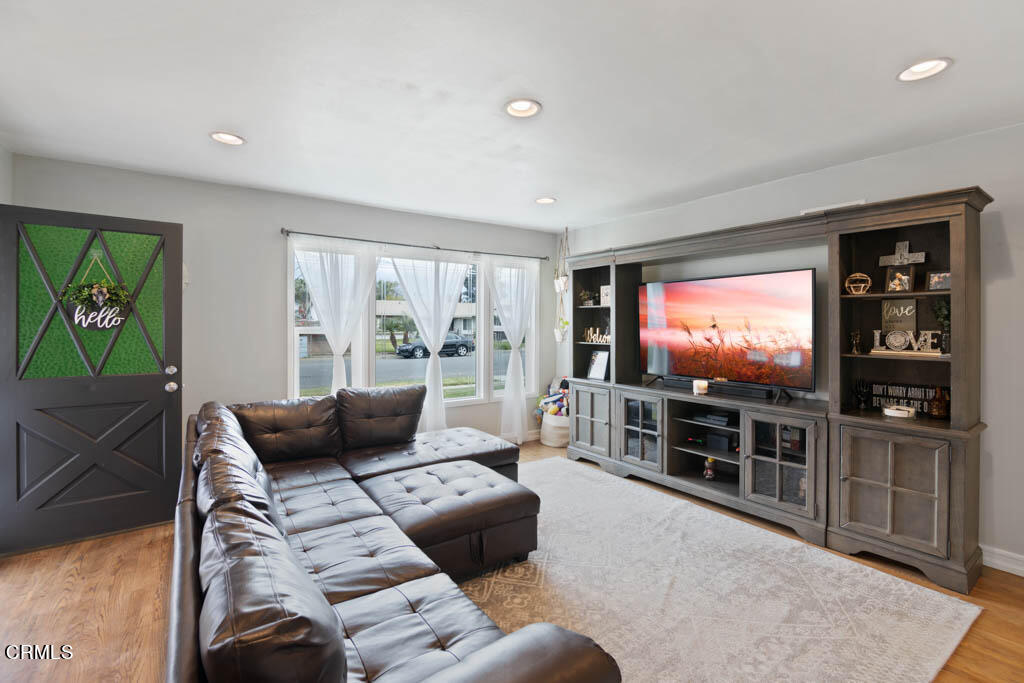 9195 Harvard Street Rancho Cucamonga, CA 91730 - Photo 11 of 37 a living room with furniture and a flat screen tv