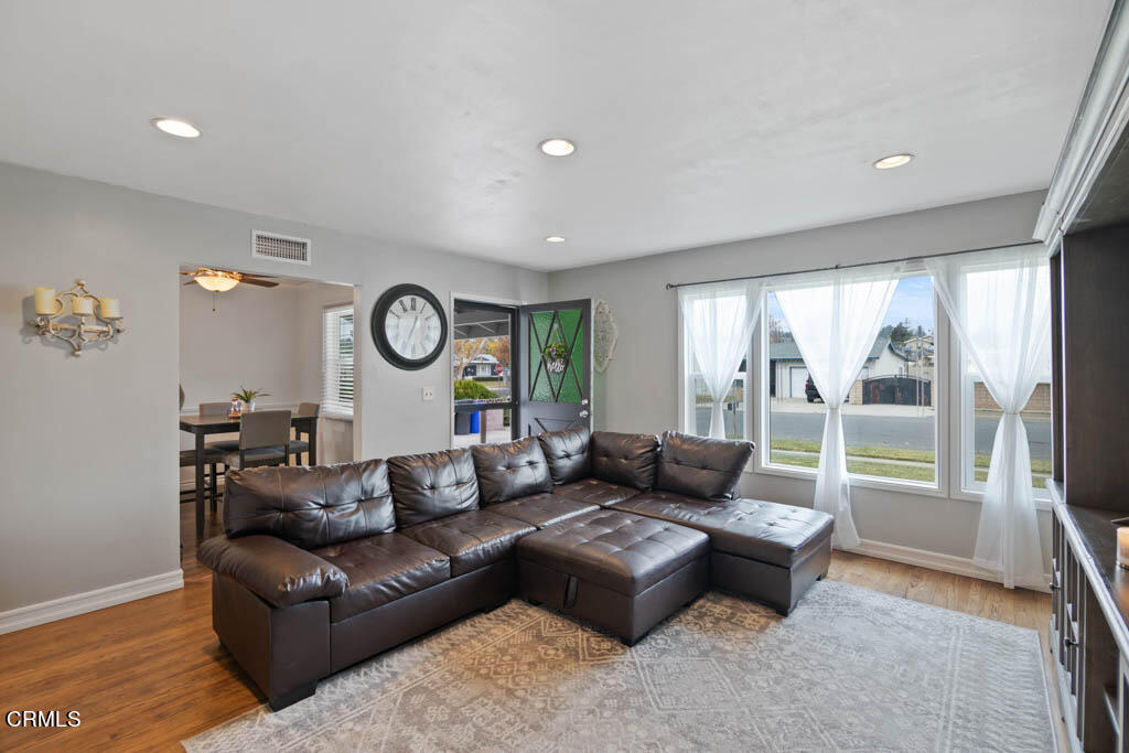 9195 Harvard Street Rancho Cucamonga, CA 91730 - Photo 12 of 37 a living room with couch and a large window