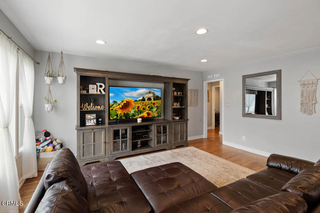 9195 Harvard Street Rancho Cucamonga, CA 91730 - Photo 13 of 37 a living room with furniture and a flat screen tv