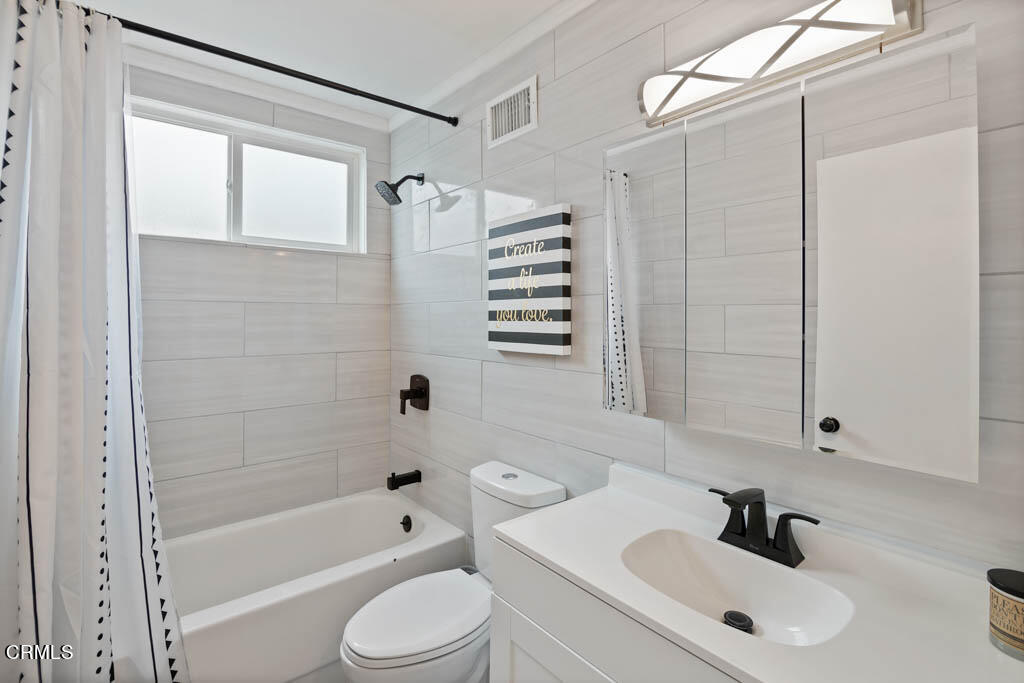 9195 Harvard Street Rancho Cucamonga, CA 91730 - Photo 14 of 37 a bathroom with a sink toilet and shower