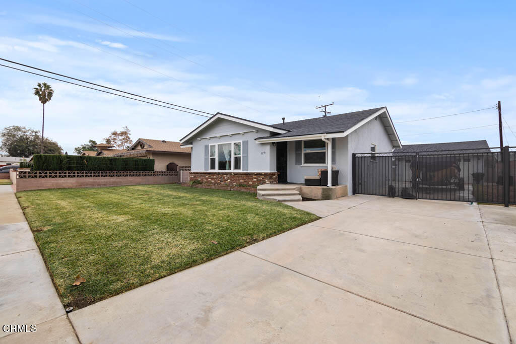 9195 Harvard Street Rancho Cucamonga, CA 91730 - Photo 2 of 37 a front view of a house with a yard