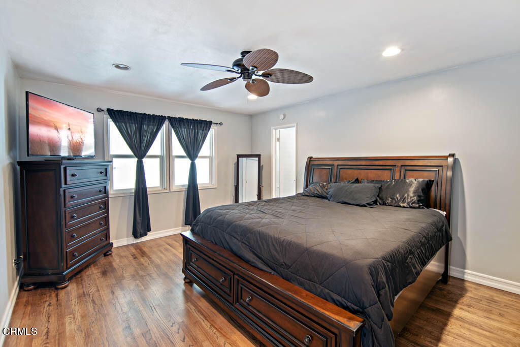 9195 Harvard Street Rancho Cucamonga, CA 91730 - Photo 22 of 37 a bedroom with a bed and a flat screen tv