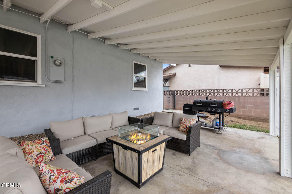 9195 Harvard Street Rancho Cucamonga, CA 91730 - Photo 27 of 37 a living room with furniture and a table