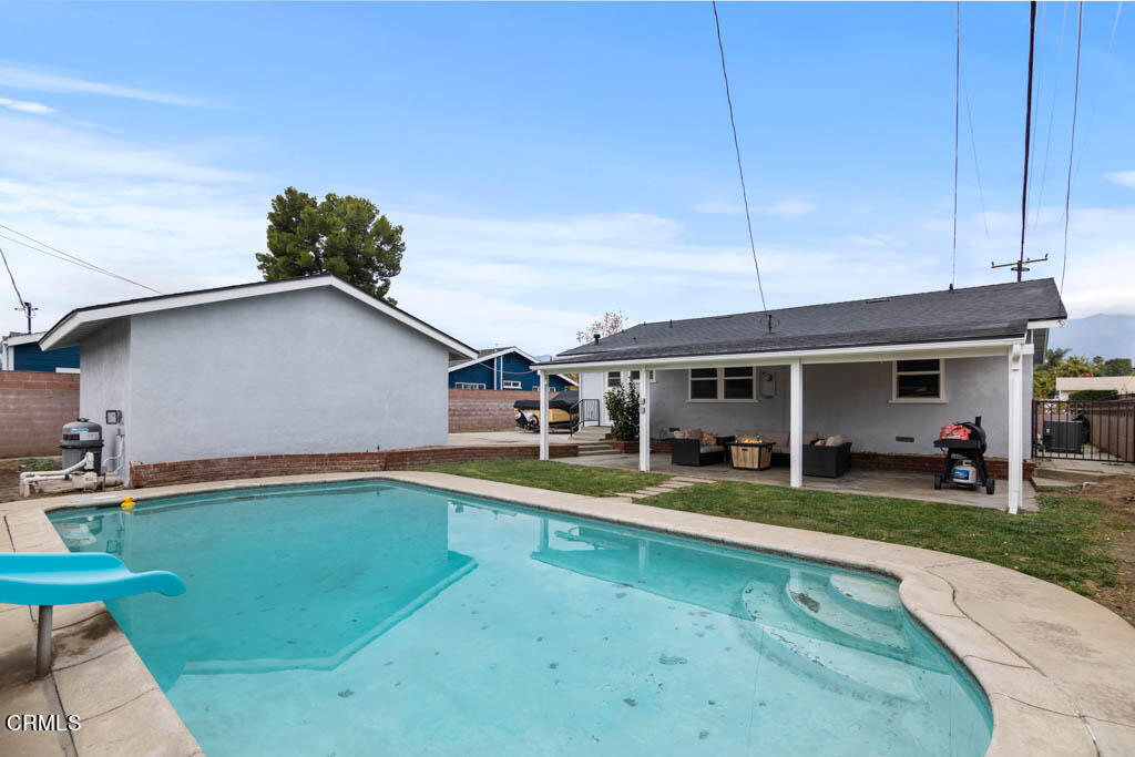9195 Harvard Street Rancho Cucamonga, CA 91730 - Photo 32 of 37 a view of a house with pool and chairs