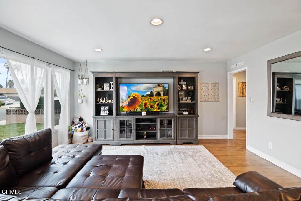 9195 Harvard Street Rancho Cucamonga, CA 91730 - Photo 10 of 37 a living room with furniture and a flat screen tv
