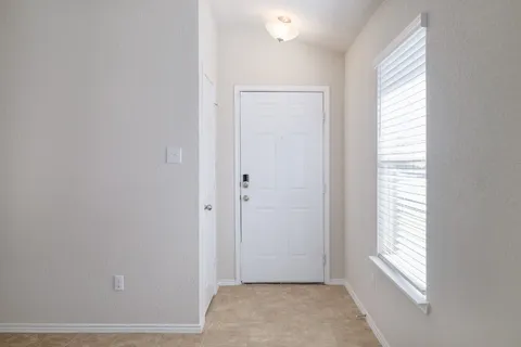 a view of an empty room and window