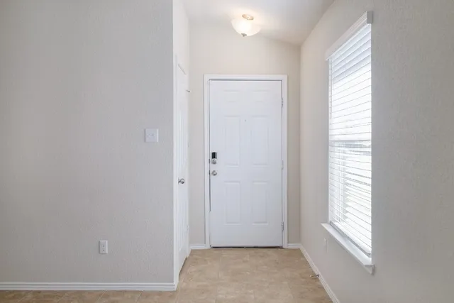 a view of an empty room and window