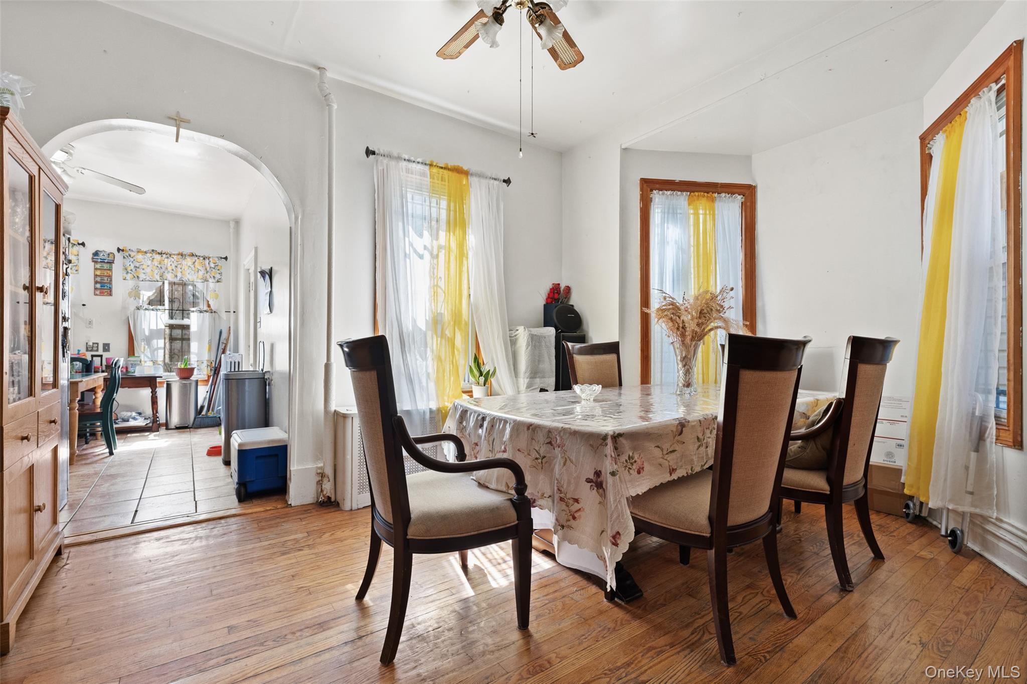 3158 Decatur Avenue Bronx, NY 10467 - Photo 1 of 7 a view of a dining room with furniture and wooden floor