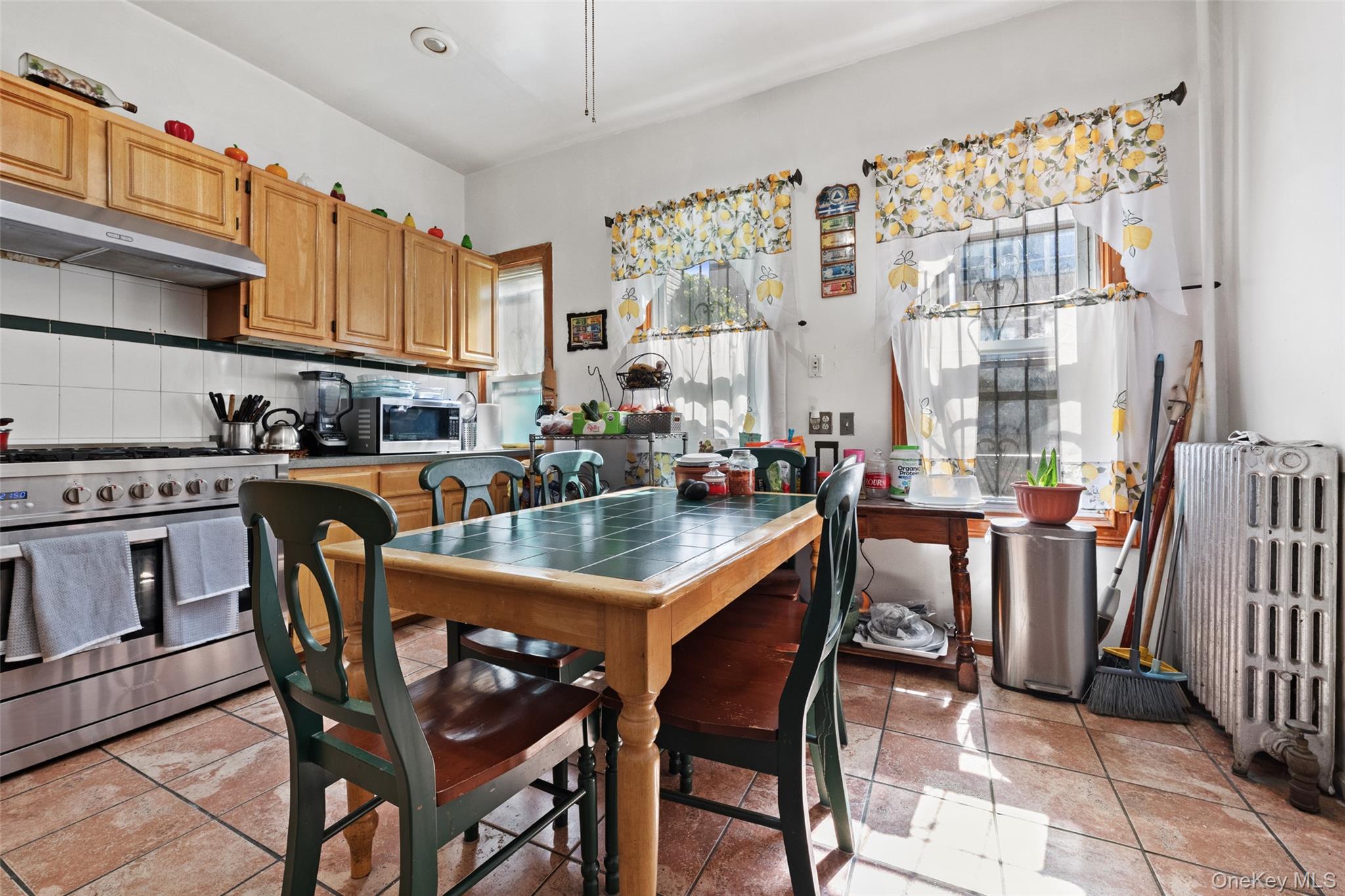 3158 Decatur Avenue Bronx, NY 10467 - Photo 2 of 7 a dining room with furniture and window