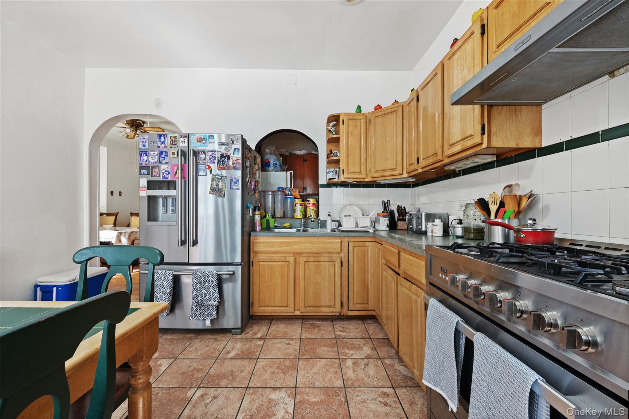 3158 Decatur Avenue Bronx, NY 10467 - Photo 3 of 7 a kitchen with stainless steel appliances granite countertop a sink and cabinets