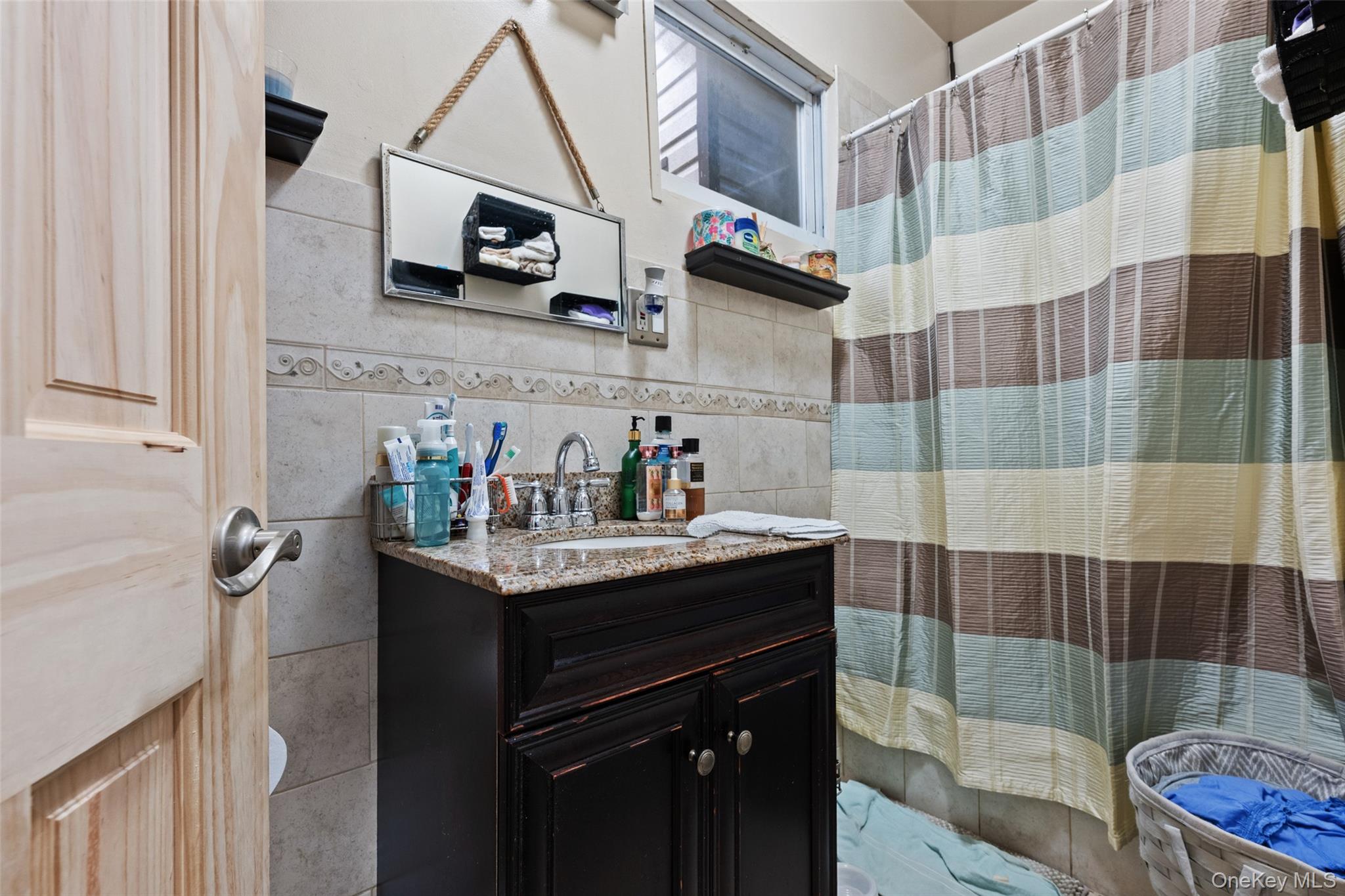 3158 Decatur Avenue Bronx, NY 10467 - Photo 7 of 7 a kitchen with a sink a stove and cabinets