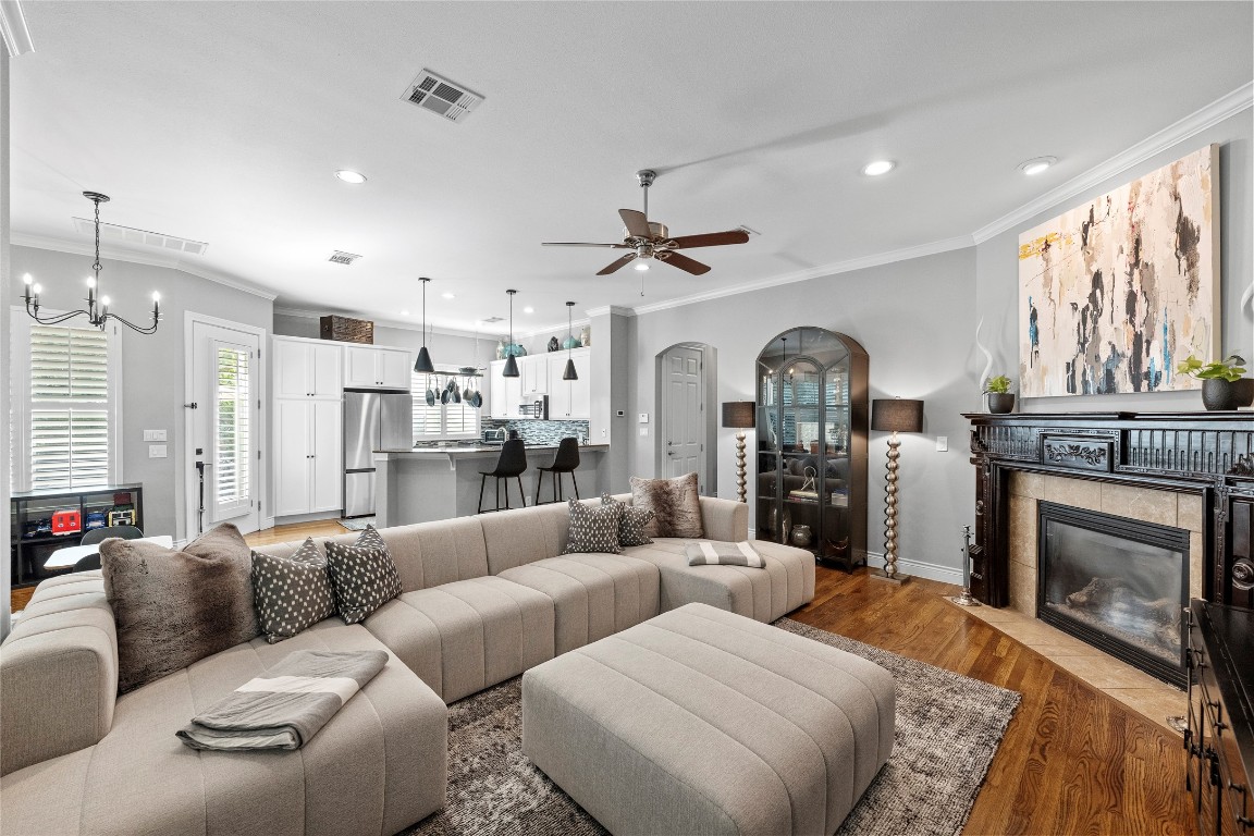 a living room with furniture fireplace and window