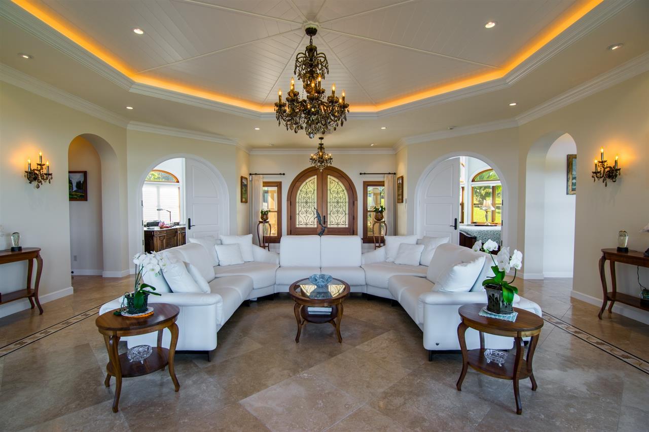 80 Hale Pili Way Haiku, HI 96708 - Photo 17 of 30 a living room with furniture and a chandelier