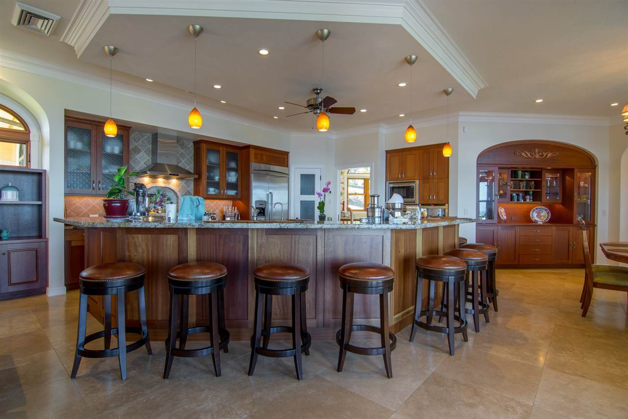80 Hale Pili Way Haiku, HI 96708 - Photo 18 of 30 a kitchen with a dining table chairs and view living room