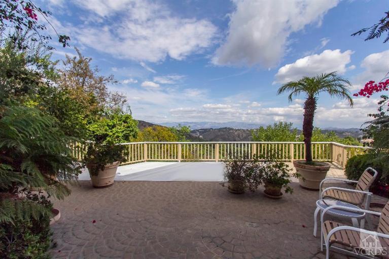 2238 Canyonback Road Los Angeles, CA 90049 - Photo 40 of 43 a view of a chair and tables