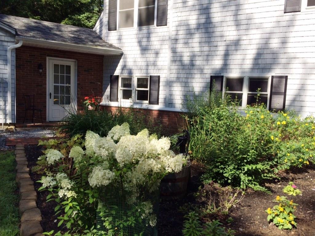 305 Murphy's Corner Road Woolwich, ME 04579 - Photo 2 of 34 This is a high summer view of the...