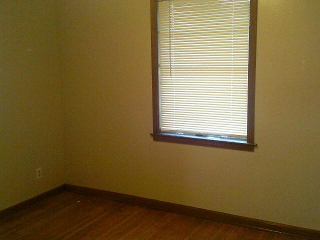 4909 Neely Road Memphis, TN 38109 - Photo 18 of 20 a view of a small space with wooden floor and a window