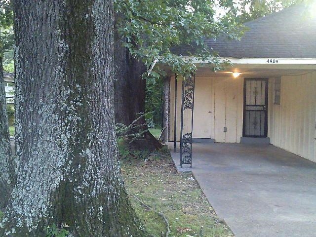 4909 Neely Road Memphis, TN 38109 - Photo 3 of 20 a view of a house with a tree