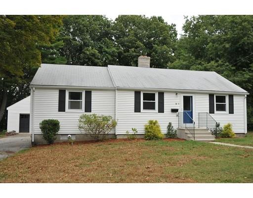 a house that has a lot of plants and trees in the background