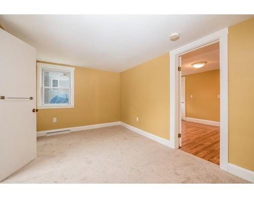 97 Burnham Road Lowell, MA 01852 - Photo 12 of 14 a view of an empty room and window