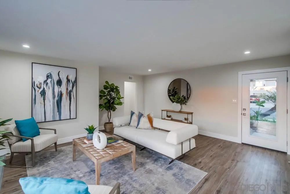 4534 Kamloop Avenue San Diego, CA 92117 - Photo 13 of 36 a living room with furniture and wooden floor