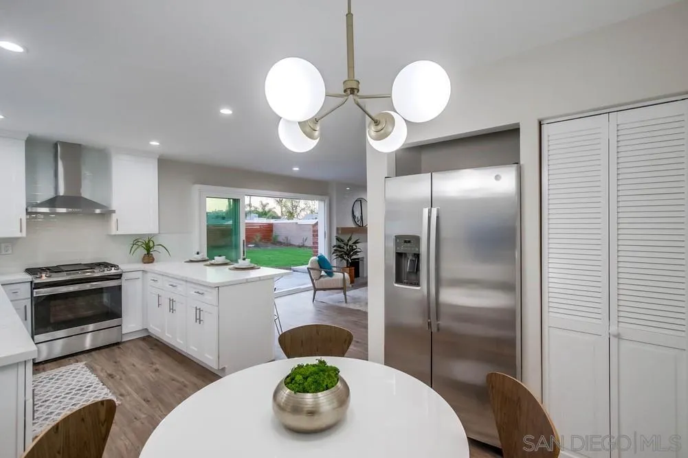 4534 Kamloop Avenue San Diego, CA 92117 - Photo 18 of 36 a kitchen with sink refrigerator and cabinets