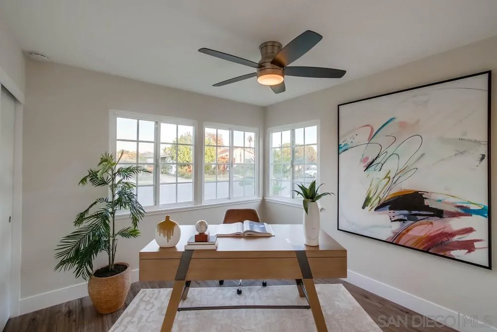 4534 Kamloop Avenue San Diego, CA 92117 - Photo 22 of 36 a living room with furniture and a large window