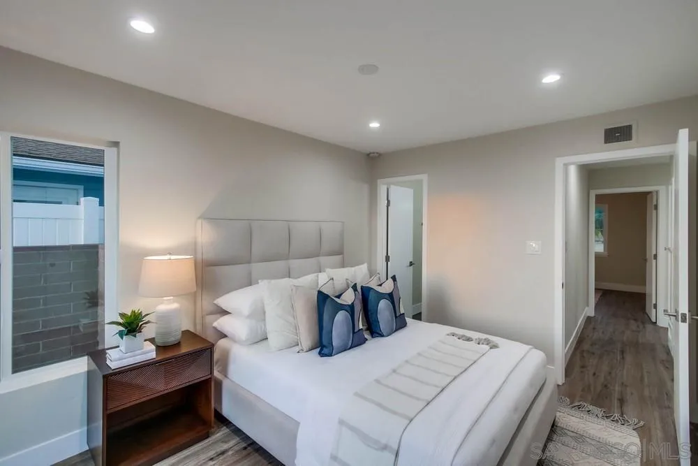 4534 Kamloop Avenue San Diego, CA 92117 - Photo 24 of 36 a bed room with a bed and a couch